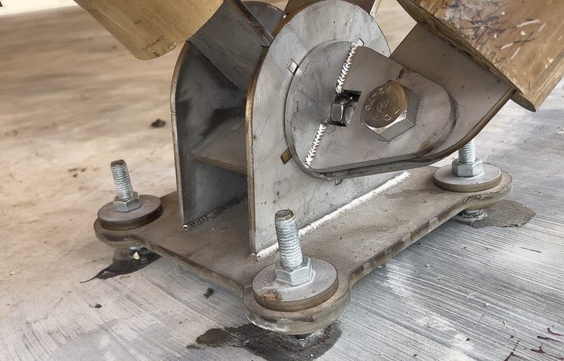 closeup of foundational steel node connecting bamboo poles to it's foundation